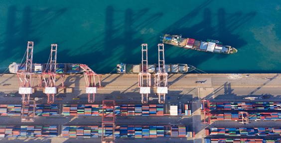 Aerial view sea port warehouse and container ship or crane ship working for delivery containers shipment