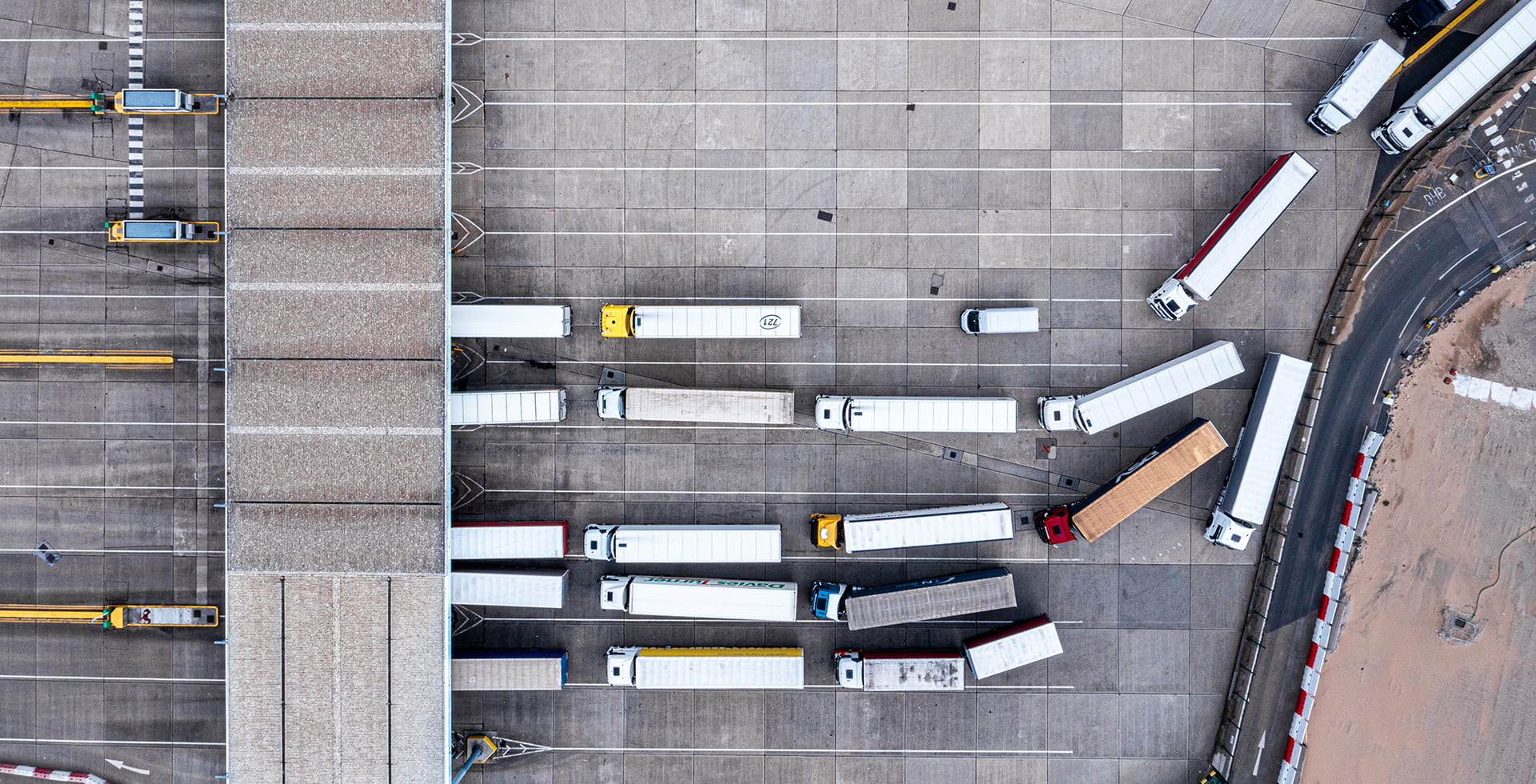 Aerial view of harbour and trucks parked along side each other ready to cross by ferry from Dover, UK to Calais, France