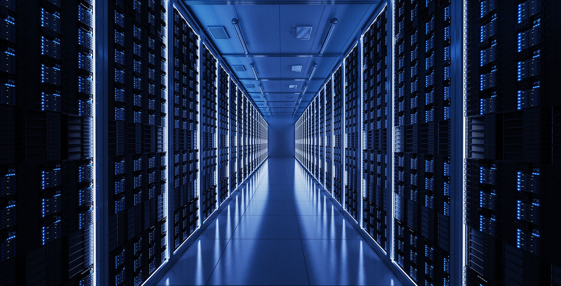 A blue-lit data center corridor lined with rows of server racks.